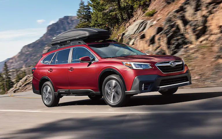 A 2022 Subaru Outback driving on a mountain highway.